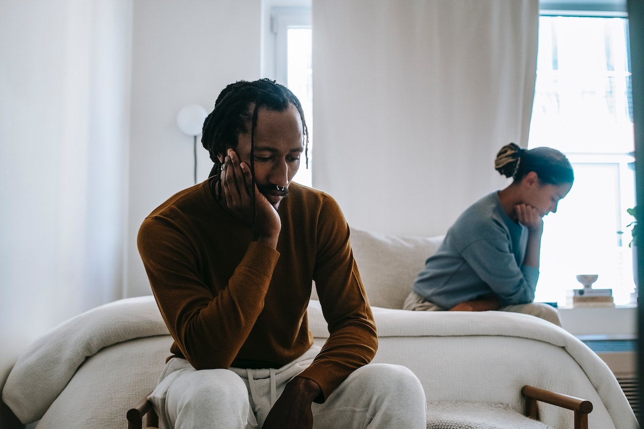 Could the Cost-of-Living Crisis Affect Divorce Rates? 1 Couple sitting apart after just arguing about the cost-of-living crisis effecting their finances