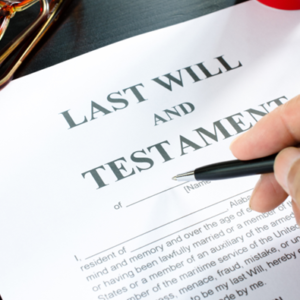 a person signing a will to show the truths about wills you should know about, best lawyer for wills and estate, lawyer for will writing, executor of will