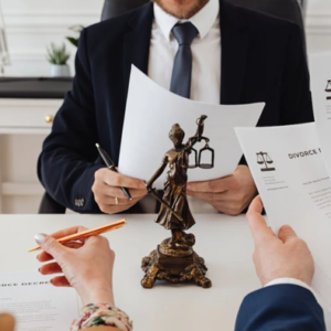 divorce solicitor looking through divorce papers to show what you can do if your spouse refuses to sign the papers, divorce papers